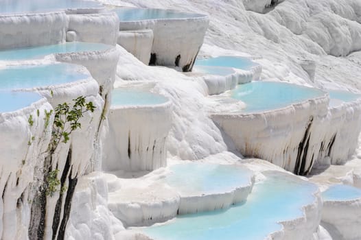 Blue water travertine pools and terraces in Pamukkale, Turkey