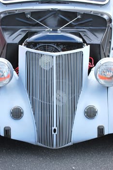 Classic vintage car displayed outdoors.