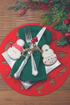 Christmas background with gingerbread cookies, silverware and fir tree. Christmas vintage concept.
