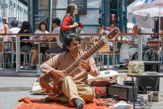 LOS ANGELES, CA - MAY 23, 2009 - Musician playing the sitar on the Promenade in Los Angeles