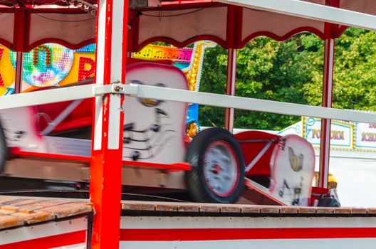 Colourful old known funfair ride, here the mountain coaster.