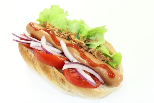 a hot dog with tomato and salad against white background