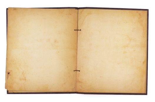 An aging scrapbook open to reveal blank, yellowing water-stained pages. Isolated on white. Includes clipping path.
