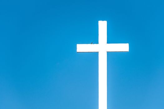 cross against the blue sky background