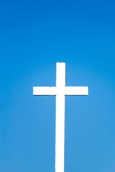 cross against the blue sky background