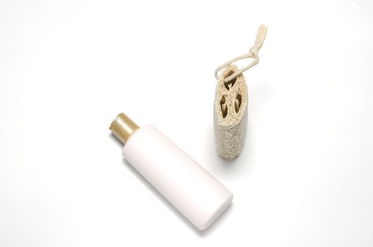 loofah and liquid soap isolated on a white background