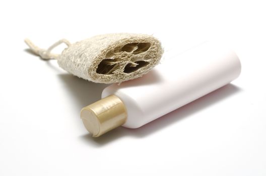 loofah and liquid soap isolated on a white background