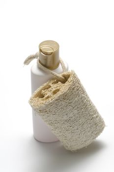 loofah and liquid soap isolated on a white background