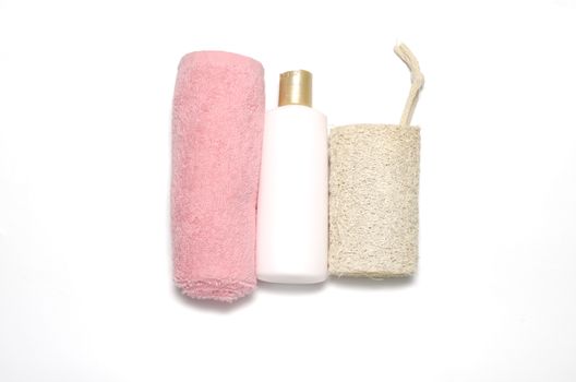 liquid soap loofah and pink towel isolated on a white background