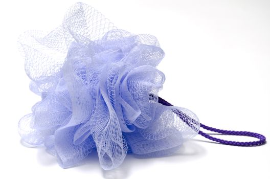purple bath puff isolated on a white background