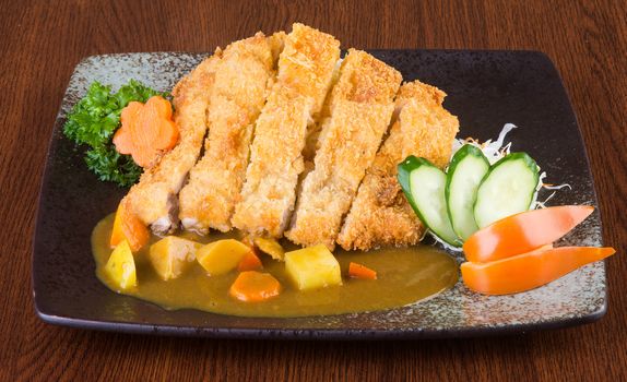 japanese cuisine. fried chicken curry on the background