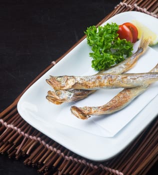 japanese cuisine. fried fish on background