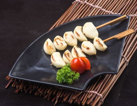 japanese cuisine. japanese bbq garlic on the background.