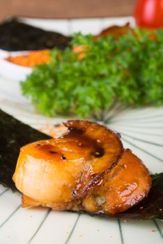 japanese cuisine. grilled shell fish on background