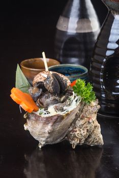 japanese cuisine. grilled shell fish on background