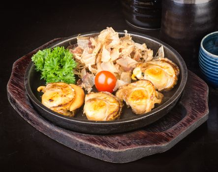 japanese cuisine. grilled shell fish on background