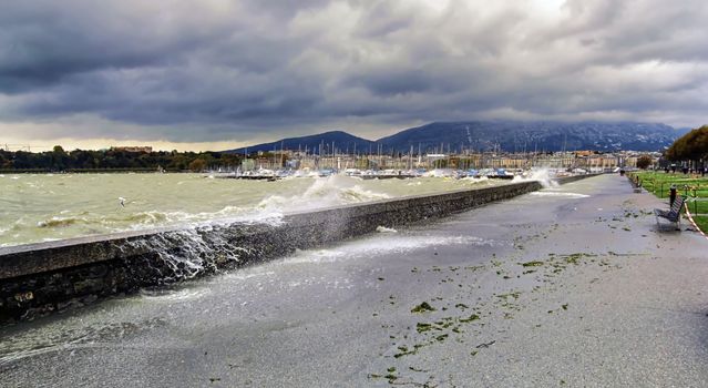 Storm and grey sky in lakefront in Geneva, Switzerland