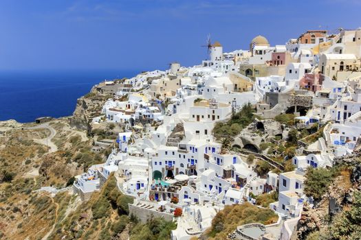 View of colorful Oia village on Santorini island by beautiful day, Greece