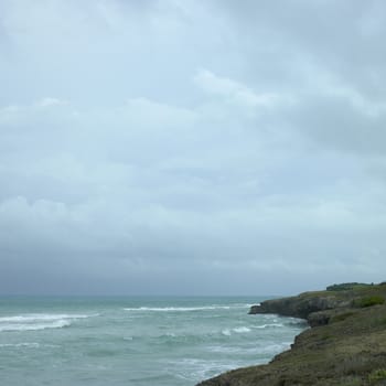 Edge of a cliff with turquoise ocean