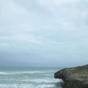 Edge of a cliff with turquoise ocean