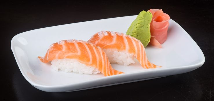 japanese cuisine. sushi salmon on background