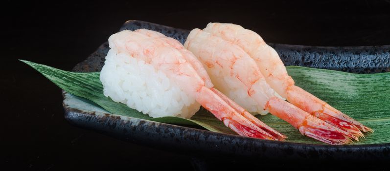 japanese cuisine. sushi shrimp on background