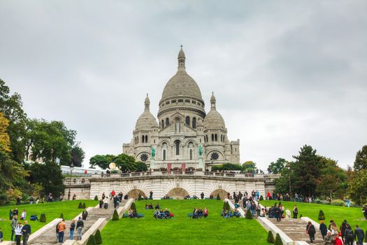 PARIS - OCTOBER 12: Basilica of the Sacred Heart of Paris (Sacre-Coeur) on October 9, 2014 in Paris, France. A popular landmark, the basilica is located at the summit of the butte Montmartre, the highest point in the city.
