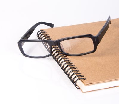 eye glasses. eye glasses with book on background