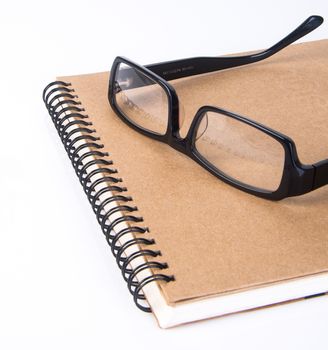 eye glasses. eye glasses with book on background