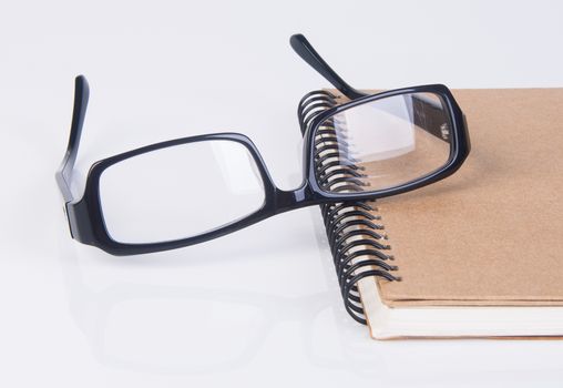 eye glasses. eye glasses with book on background