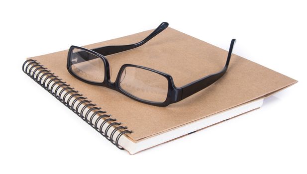 eye glasses. eye glasses with book on background