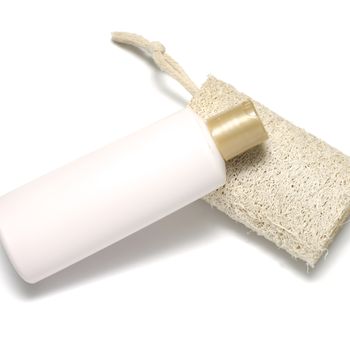loofah and liquid soap isolated on a white background