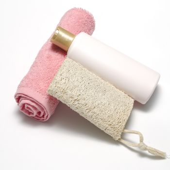 liquid soap loofah and pink towel isolated on a white background