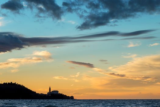 Silhouette of the town Piran with cathedral, view from strunjan