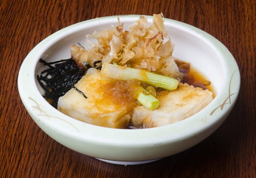 japanese cuisine. fried tofu on background