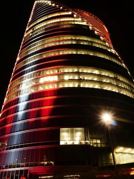 modern buildings in red colours at night