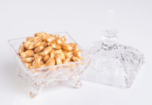 crystal bowl with food on a background