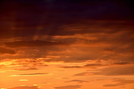 A sunset with nice sunrays and warm colours.