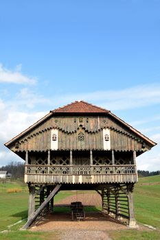 Traditional Slovenian structure, used for storing farming tools, drying corn, and so on