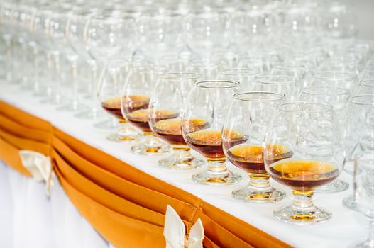 set of brandy glasses at buffet table