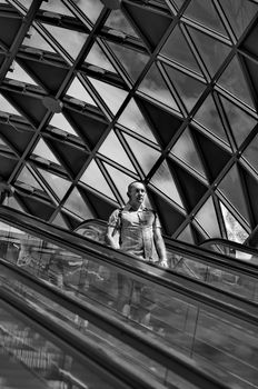 BUDAPEST, HUNGARY - AUGUST 17: Passengers passing by on the escalator  in Budapest, Hungary onAugust 17, 2014