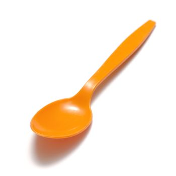 orange plastic spoon on a white background