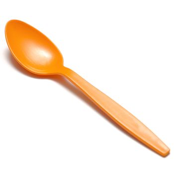 orange plastic spoon on a white background