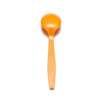 orange plastic spoon on a white background