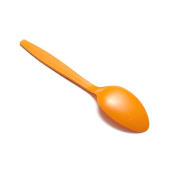 orange plastic spoon on a white background