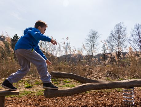 Young boy climbing on playground