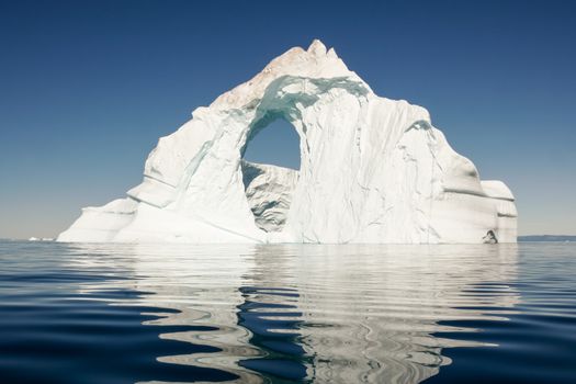 A recent calving of a glacier in Greenland created a lone iceberg.