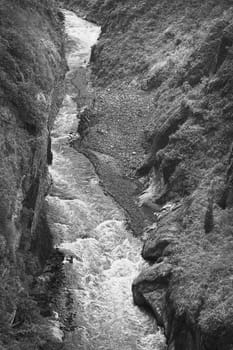 Monochrome image of the canyon of the Pastaza River photographed from the San Francisco Bridge in the small town of Banos in Tungurahua Province, Central Ecuador 