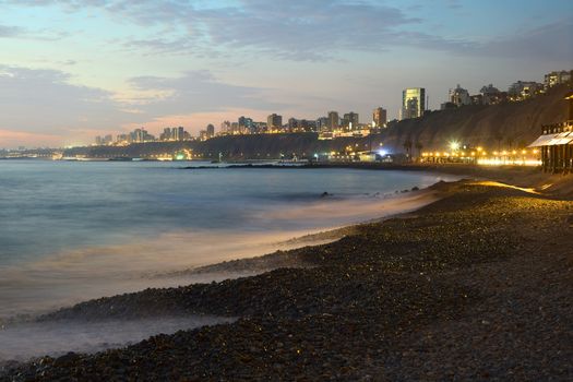 The coast of the district of Miraflores, Lima, Peru at dusk
