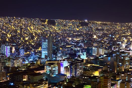 View over the city center of La Paz, Bolivia at night. The Metropolitan Cathedral can be seen a bit to the right from the center of the image.  